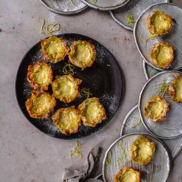 Vegan Pastel de Nata recipe, Portuguese cuisine; saffron silky-smooth cinnamon lemony scented custard on a soft crispy puff pastry tart bed. Edward Daniel ©.