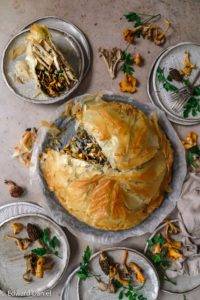 Vegan Celeriac Wild Mushroom Pithivier recipe; wild mushroom parsley on a celeriac thyme marjoram porcini almond cream bed encased in crisp puff pastry. Edward Daniel ©.