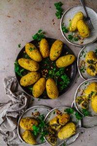 Vegan Koupes recipe, Greek/Cypriot cuisine; umami mushroom, kalamata olives, onions, garlic, parsley and pine nuts encased in a bulgur wheat polenta pastry. Edward Daniel ©.