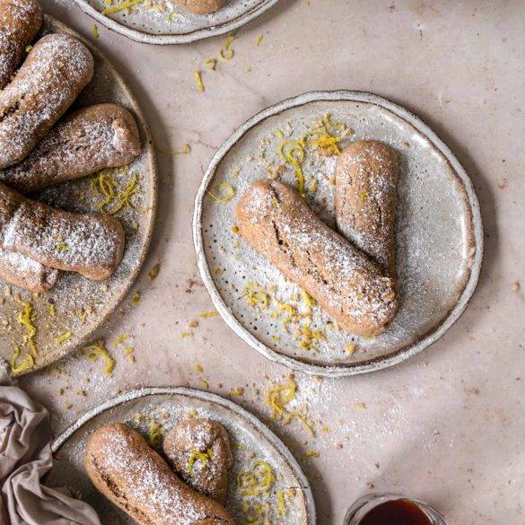 Vegan gluten-free Sponge Fingers aka Lady Fingers/ Savoiardi recipe; sweet dry vanilla sponge cakes biscuits, with walnuts and dusted with icing sugar. Edward Daniel ©.