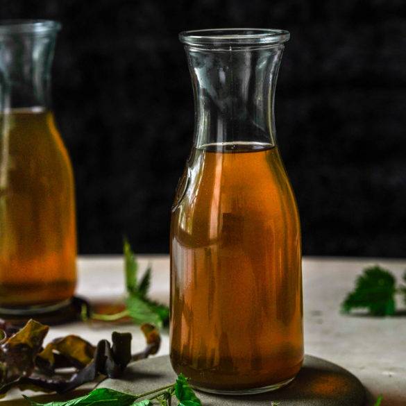 Vegan Stock recipe, a vegan condiment, paleo too; umami kelp seaweed and peppery nettles steeped with onion, carrot, celery, bay leaves, thyme and crushed peppercorns. Edward Daniel ©.