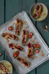 Steamed baked pillowy sorghum rice rolled pastry layered with sweet treacly burst fruit preserve; Jam Roly-Poly. Edward Daniel ©.