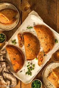 Herbed earthy butternut, potato, swede and carrot filling enfolded in a cassava chickpea and buckwheat pastry; Vegan Cornish Pasty. Edward Daniel ©.