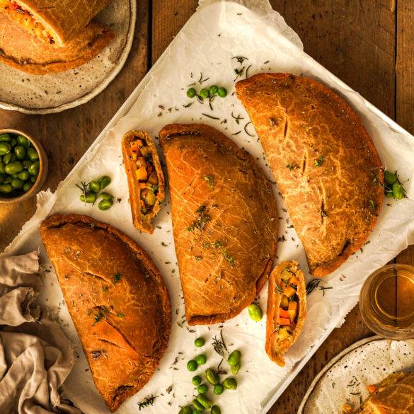 Herbed earthy butternut, potato, swede and carrot filling enfolded in a cassava chickpea and buckwheat pastry; Vegan Cornish Pasty. Edward Daniel ©.